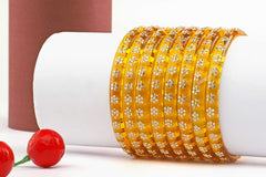 Yellow Glass Kadas with Handcrafted Floral Beads – Set of 8