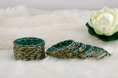 Cadmium Green Glass Bangles Golden Carved Cuts Festive Wear